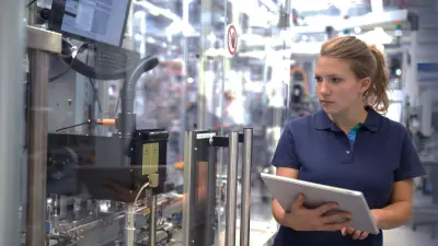 Woman working on a machine 